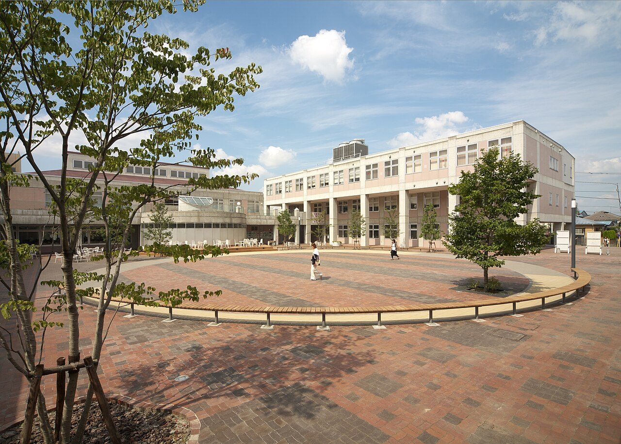 The brick plaza and white buildings of Jissen Women's University's Hino campus