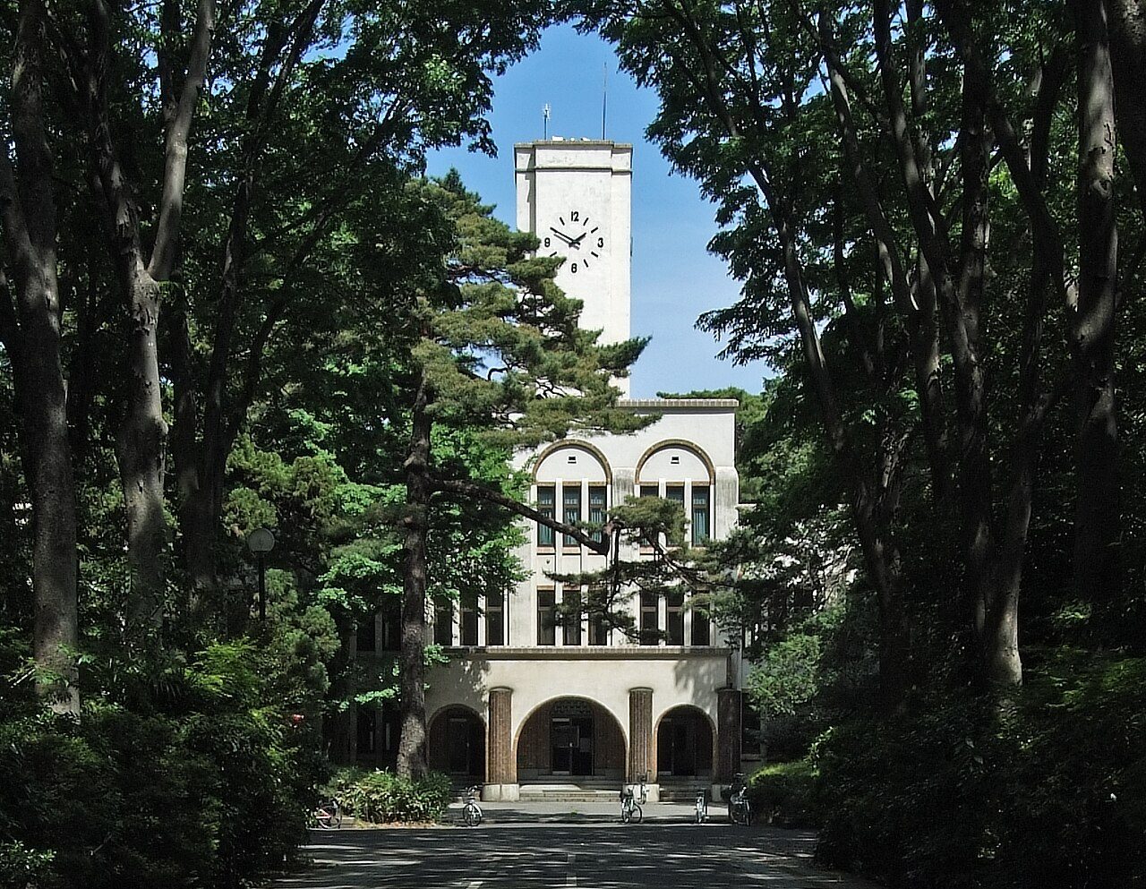 The clock-tower main hall of Tokyo University of Agriculture and Technology's Fuchu campus, framed by trees